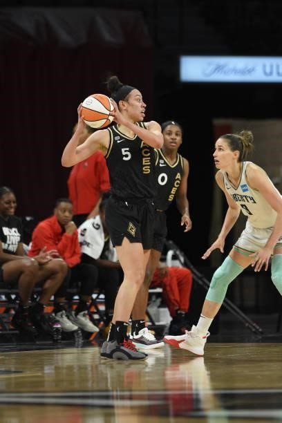 Dearica Hamby of the Las Vegas Aces handles the ball against Rebecca Allen of the New York Liberty on June 15, 2021 at Michelob ULTRA Arena in Las...