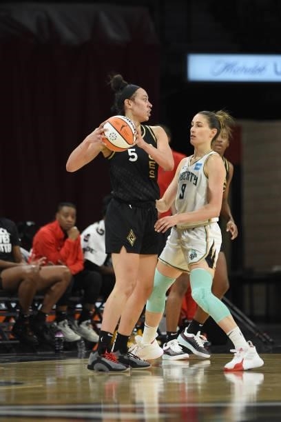 Dearica Hamby of the Las Vegas Aces handles the ball against Rebecca Allen of the New York Liberty on June 15, 2021 at Michelob ULTRA Arena in Las...