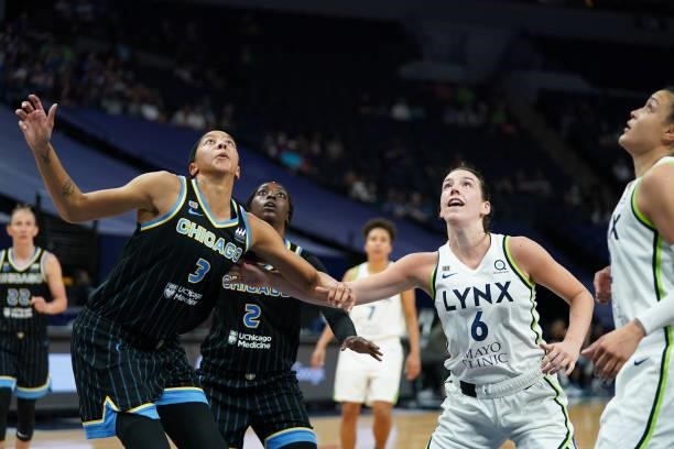 Candace Parker of the Chicago Sky and Bridget Carleton of the Minnesota Lynx fight for rebound during the game on June 15, 2021 at Target Center in...