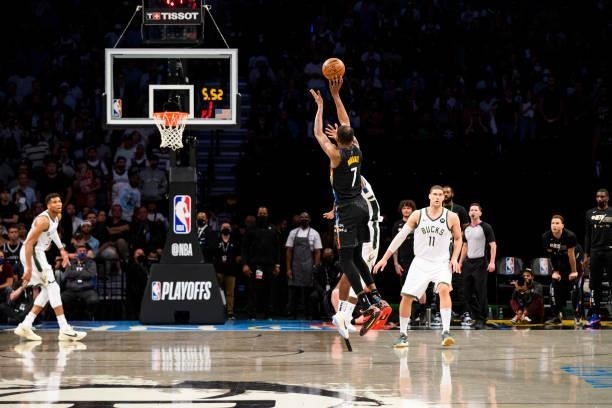 Kevin Durant of the Brooklyn Nets shoots a three point basket to give the Brooklyn Nets the lead against the Milwaukee Bucks during Round 2, Game 5...