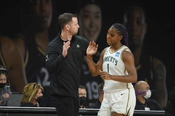 Reshanda Gray of the New York Liberty and Head Coach Walt Hopkins high five during the game against the Las Vegas Aces on June 15, 2021 at Michelob...