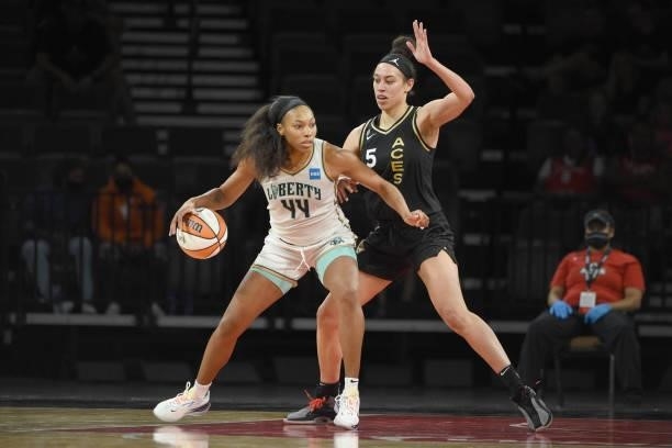 Betnijah Laney of the New York Liberty handles the ball against Dearica Hamby of the Las Vegas Aces on June 15, 2021 at Michelob ULTRA Arena in Las...
