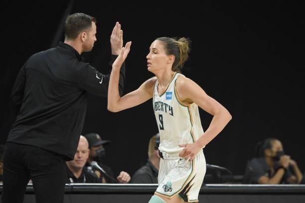 Head Coach Walt Hopkins and Rebecca Allen of the New York Liberty high five during the game against the Las Vegas Aces on June 15, 2021 at Michelob...