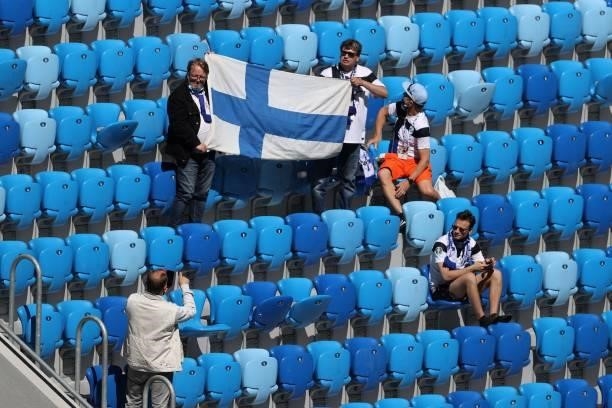 Finland fans pose with their flag prior to the UEFA EURO 2020 Group B football match between Finland and Russia at the Saint Petersburg Stadium in...