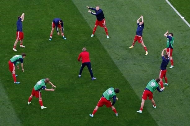 Russia's players warm up prior to the UEFA EURO 2020 Group B football match between Finland and Russia at the Saint Petersburg Stadium in Saint...