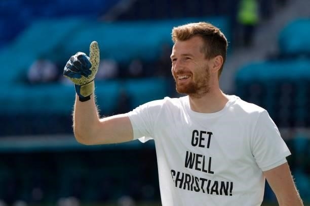 Finland's goalkeeper Lukas Hradecky wears a shit with a greeting to Denmark's Christian Eriksen prior to the UEFA EURO 2020 Group B football match...