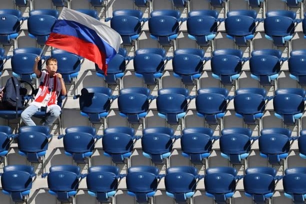 Russia fan waves a flag prior to the UEFA EURO 2020 Group B football match between Finland and Russia at the Saint Petersburg Stadium in Saint...