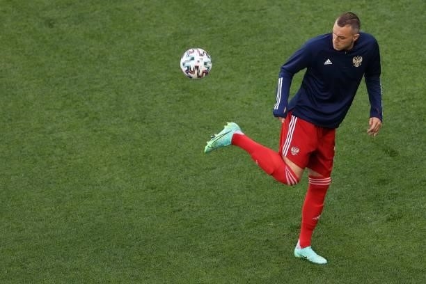 Russia's forward Artem Dzyuba warms up on the ball prior to the UEFA EURO 2020 Group B football match between Finland and Russia at the Saint...