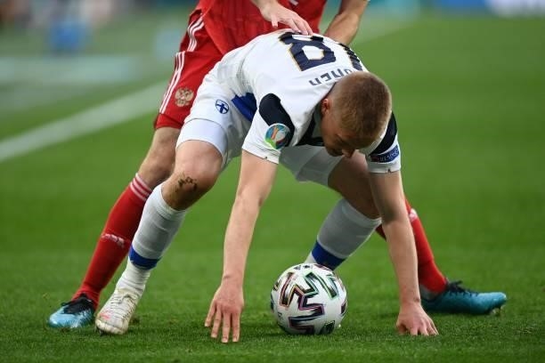 Finland's defender Jere Uronen vies during the UEFA EURO 2020 Group B football match between Finland and Russia at the Saint Petersburg Stadium in...