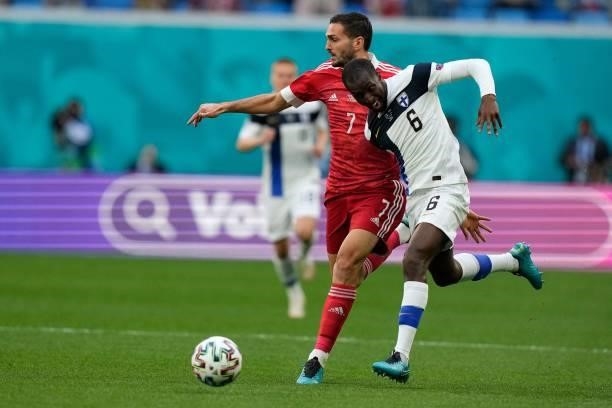 Russia's midfielder Magomed Ozdoev and Finland's midfielder Glen Kamara vie for the ball during the UEFA EURO 2020 Group B football match between...