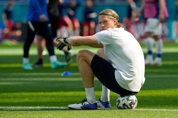 Finland's goalkeeper Anssi Jaakkola sits on a ball prior to the UEFA EURO 2020 Group B football match between Finland and Russia at the Saint...