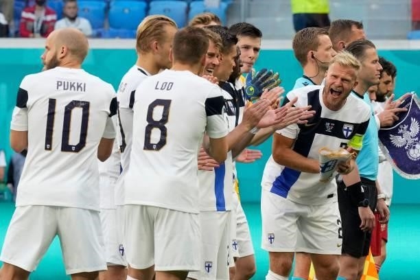 Finland's defender Paulus Arajuuri and his teammates line up prior to the UEFA EURO 2020 Group B football match between Finland and Russia at the...