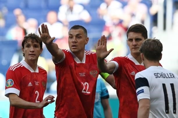 Russia's defender Mario Fernandes, Russia's forward Artem Dzyuba and Russia's defender Igor Diveev reacts during the UEFA EURO 2020 Group B football...