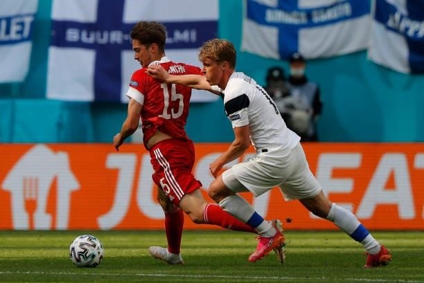 Russia's forward Aleksey Miranchuk and Finland's midfielder Rasmus Schuller vie during the UEFA EURO 2020 Group B football match between Finland and...
