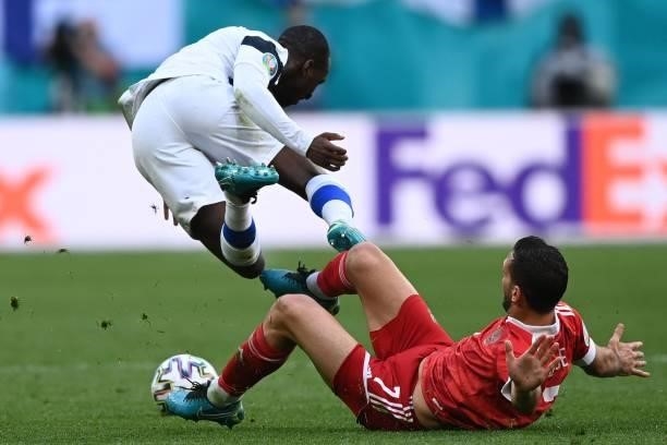 Finland's midfielder Glen Kamara and Russia's midfielder Magomed Ozdoev vie during the UEFA EURO 2020 Group B football match between Finland and...