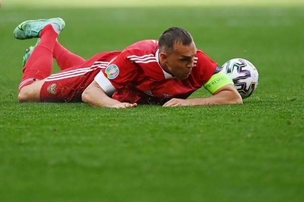Russia's forward Artem Dzyuba ends up on the floor during the UEFA EURO 2020 Group B football match between Finland and Russia at the Saint...