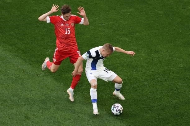 Russia's forward Aleksey Miranchuk and Finland's defender Jere Uronen vie during the UEFA EURO 2020 Group B football match between Finland and Russia...