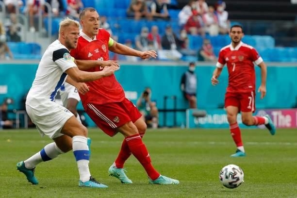 Finland's defender Paulus Arajuuri and Russia's forward Artem Dzyuba vie during the UEFA EURO 2020 Group B football match between Finland and Russia...