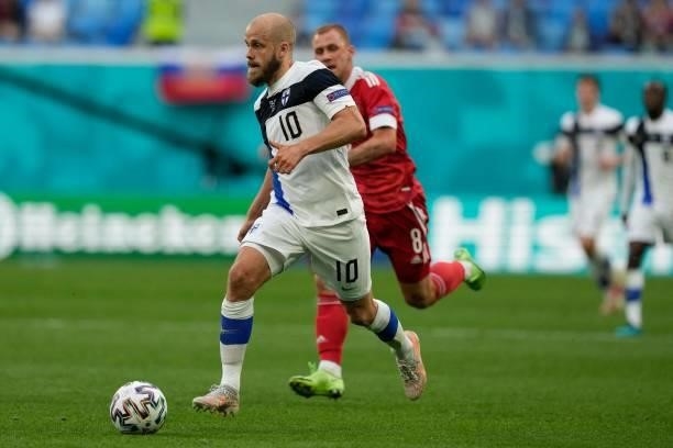 Finland's forward Teemu Pukki ais chassed by Russia's midfielder Dmitriy Barinov during the UEFA EURO 2020 Group B football match between Finland and...