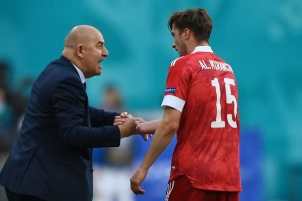 Russia's forward Aleksey Miranchuk celebrates scoring the opening goal with his coach Stanislav Cherchesov during the UEFA EURO 2020 Group B football...