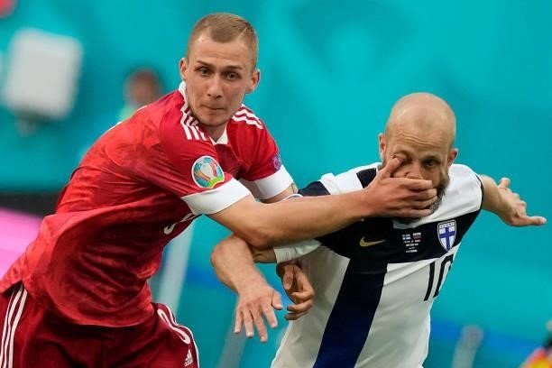 Russia's midfielder Dmitriy Barinov catches Finland's forward Teemu Pukki in the face during the UEFA EURO 2020 Group B football match between...