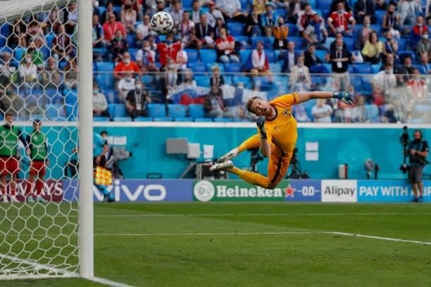 Russia's forward Aleksey Miranchuk scores the opening goal past Finland's goalkeeper Lucas Hradecky during the UEFA EURO 2020 Group B football match...