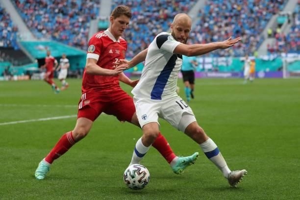 Finland's forward Teemu Pukki and Russia's defender Igor Diveev vie during the UEFA EURO 2020 Group B football match between Finland and Russia at...