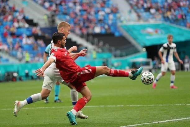 Russia's midfielder Magomed Ozdoev controls the ball during the UEFA EURO 2020 Group B football match between Finland and Russia at the Saint...