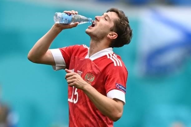Russia's forward Aleksey Miranchuk has a drink during the UEFA EURO 2020 Group B football match between Finland and Russia at the Saint Petersburg...