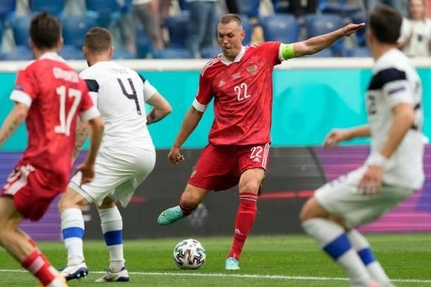 Russia's forward Artem Dzyuba shoots during the UEFA EURO 2020 Group B football match between Finland and Russia at the Saint Petersburg Stadium in...