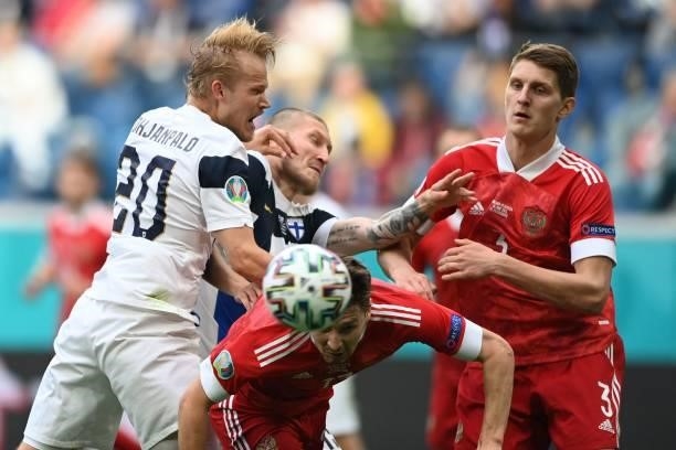 Russia's midfielder Daler Kuzyaev heads the ball during the UEFA EURO 2020 Group B football match between Finland and Russia at the Saint Petersburg...