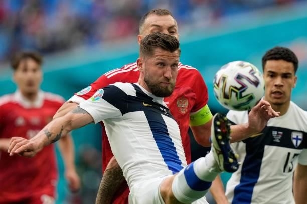 Finland's defender Joona Toivio and Russia's forward Artem Dzyuba vie during the UEFA EURO 2020 Group B football match between Finland and Russia at...