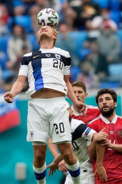 Finland's forward Joel Pohjanpalo heads the ball during the UEFA EURO 2020 Group B football match between Finland and Russia at the Saint Petersburg...