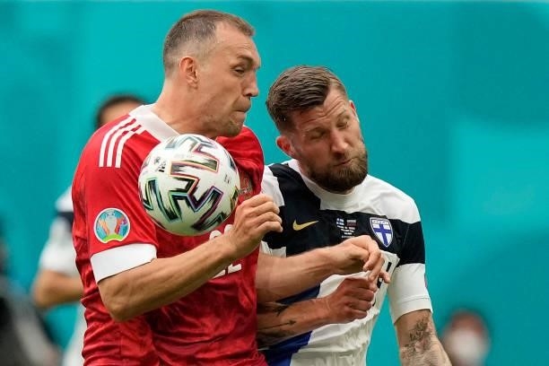Finland's defender Joona Toivio and Russia's forward Artem Dzyuba vie during the UEFA EURO 2020 Group B football match between Finland and Russia at...