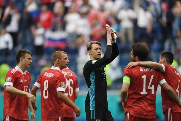 Russia's players including Russia's goalkeeper Matvei Safonov celebrate after the final whistle of the UEFA EURO 2020 Group B football match between...