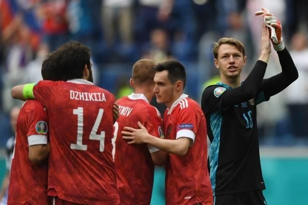 Russia's players including Russia's goalkeeper Matvei Safonov celebrate after the final whistle of the UEFA EURO 2020 Group B football match between...