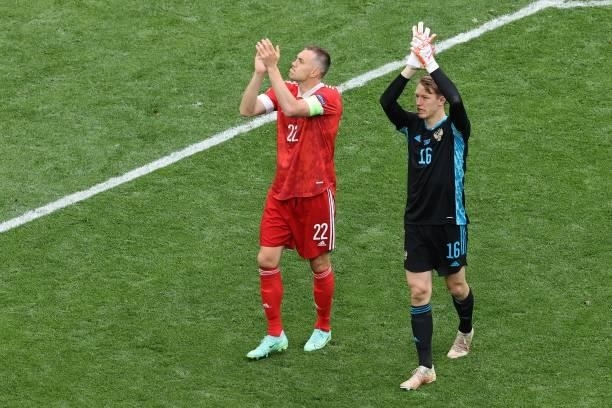 Russia's forward Artem Dzyuba and Russia's goalkeeper Matvei Safonov celebrate after the final whistle of the UEFA EURO 2020 Group B football match...