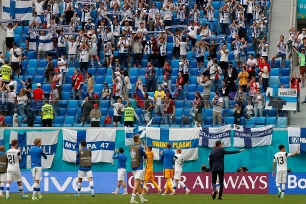 Finland's palyers applaud their fans after the UEFA EURO 2020 Group B football match between Finland and Russia at the Saint Petersburg Stadium in...
