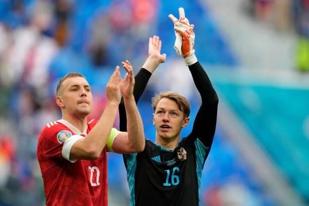 Russia's forward Artem Dzyuba mand Russia's goalkeeper Matvei Safonov celebrate after the final whistle of the UEFA EURO 2020 Group B football match...