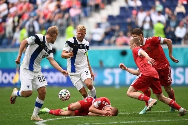 Russia's midfielder Dmitriy Barinov is injured during the UEFA EURO 2020 Group B football match between Finland and Russia at the Saint Petersburg...