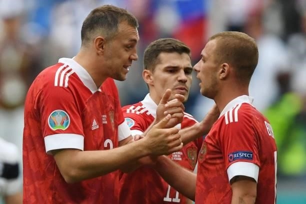 Russia's forward Artem Dzyuba and Russia's midfielder Dmitriy Barinov react during the UEFA EURO 2020 Group B football match between Finland and...