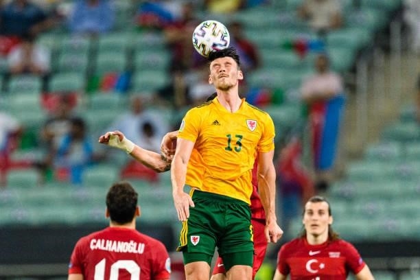 Kieffer Moore of Wales heads the ball during the UEFA Euro 2020 Championship Group A match between Turkey and Wales on June 16, 2021 in Baku,...