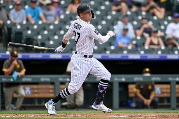 Trevor Story of the Colorado Rockies hits a first inning RBI double against the San Diego Padres at Coors Field on June 16, 2021 in Denver, Colorado.