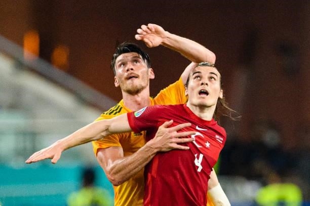 Kieffer Moore of Wales battles for the ball with Caglar Soyuncu of Turkey during the UEFA Euro 2020 Championship Group A match between Turkey and...