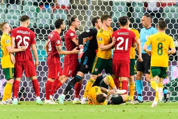 Irfan Can Kahveci of Turkey argues with Ben Davies of Wales during the UEFA Euro 2020 Championship Group A match between Turkey and Wales on June 16,...