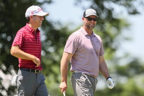 Former NFL player Scott Chandler talks with Will Grimmer prior to the Wichita Open Benefitting KU Wichita Pediatrics at Crestview Country Club on...