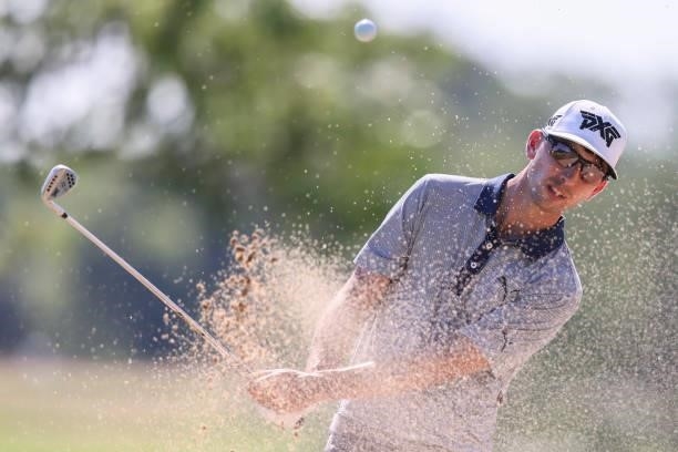 Seth Reeves plays his shot out of a bunker on the 9th hole prior to the Wichita Open Benefitting KU Wichita Pediatrics at Crestview Country Club on...