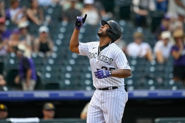 Elias Diaz of the Colorado Rockies celebrates after hitting a fourth inning solo home run against the San Diego Padres at Coors Field on June 16,...