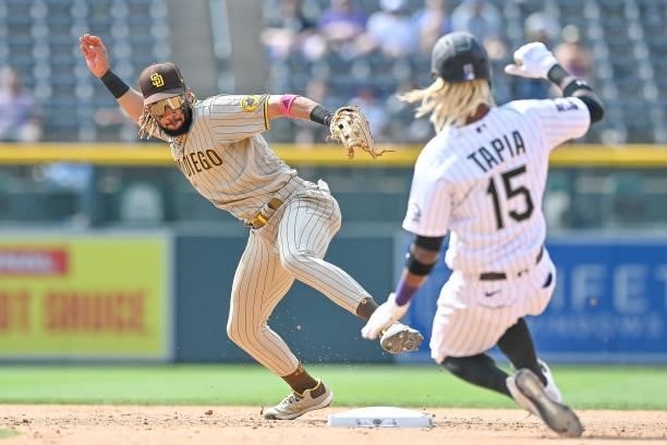 Fernando Tatis Jr. #23 of the San Diego Padres steps on second base to force out Raimel Tapia of the Colorado Rockies to end the eighth inning of a...