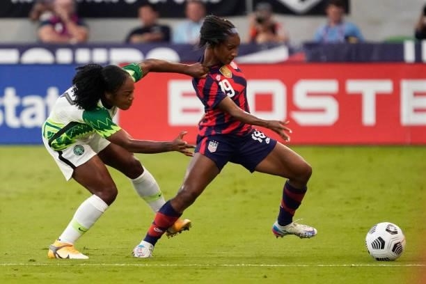 Crystal Dunn of the United States is grabbed by Francisca Ordega of Nigeria during the first half of their WNT Summer Series game at Q2 Stadium on...